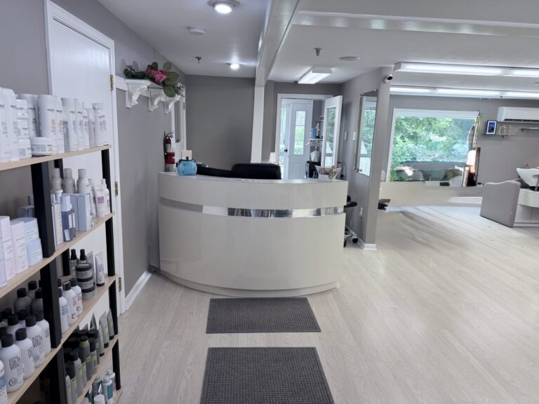 Reception and waiting area at New Image Hair Salon in Dennis Village